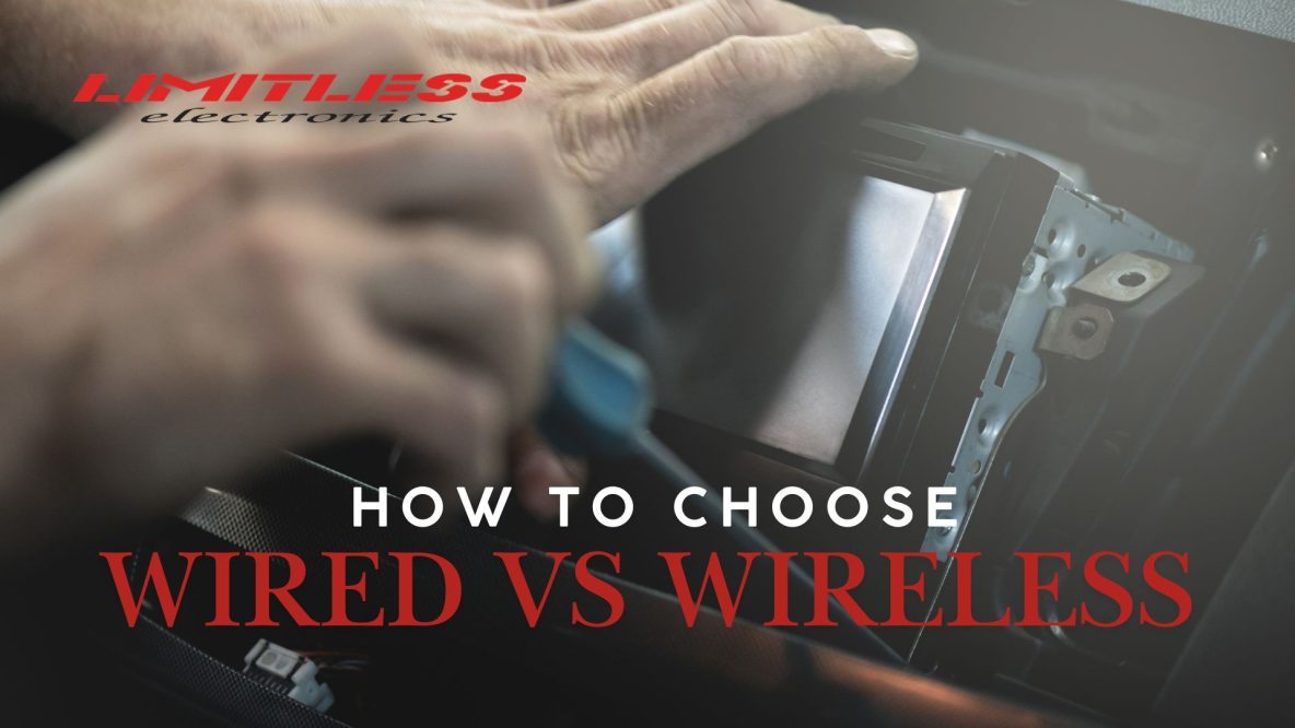 man working on wired car stereo system