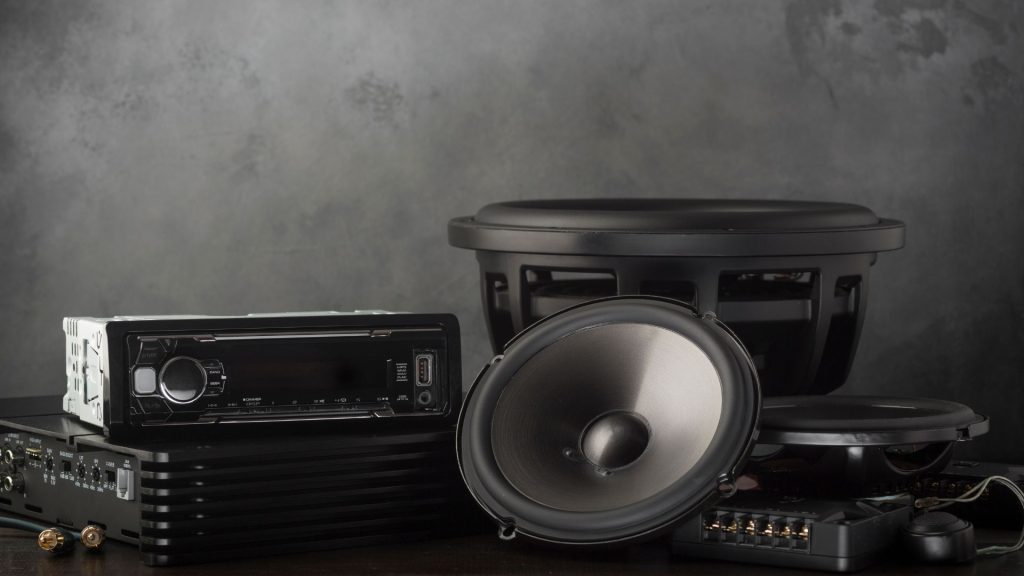 car speakers and car subwoofers on a table